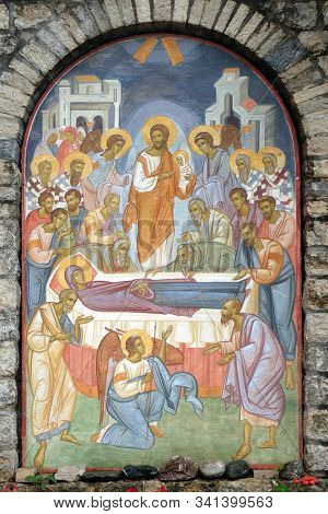 TREBINJE, BOSNIA AND HERZEGOVINA - MAY 01, 2019: Death of the Virgin, fresco at the wall of the 15th-century monastery Assumption of the Virgin Mary in Tvrdos near Trebinje, Bosnia and Herzegovina