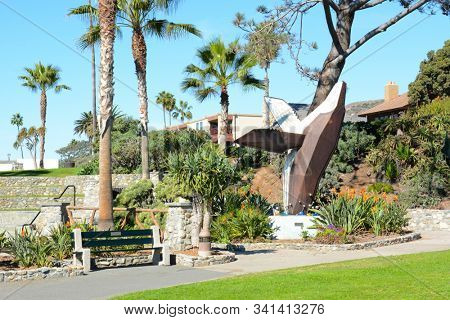 LAGUNA BEACH, CA, NOV 14, 2016: Humpback Whale Sculpture in Heisler Park. Stretching along the bluffs this oceanfront park has walking trails, gardens, a marine refuge, picnic tables and barbeques.