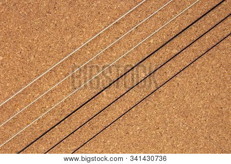 Classical Guitar Strings On Balsa Wood Texture Background