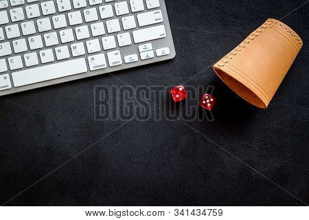 Hazard Gemes Online Concept. Dices Near Keyboard On Black Background Top-down Copy Space