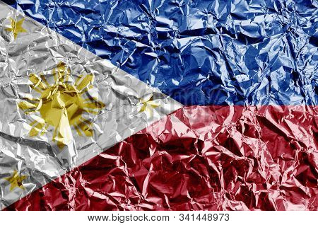 Philippines Flag Depicted In Paint Colors On Shiny Crumpled Aluminium Foil Closeup. Textured Banner 