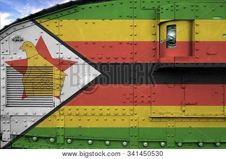 Zimbabwe Flag Depicted On Side Part Of Military Armored Tank Closeup. Army Forces Conceptual Backgro