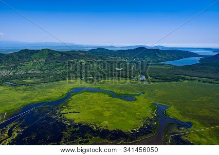 Panoramic View Of The City Petropavlovsk-kamchatsky And Volcanoes: Koryaksky Volcano, Avacha Volcano