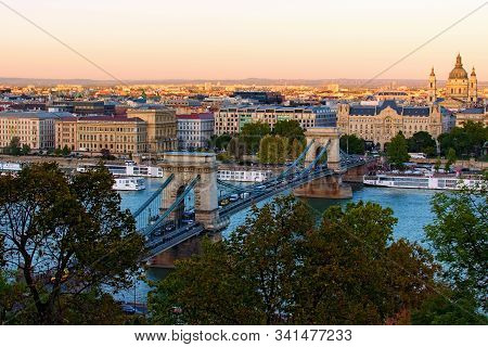 Beautiful Landscape Photo Of Ancient Budapest. One Of The Main Attractions Are The Chain Bridge Over