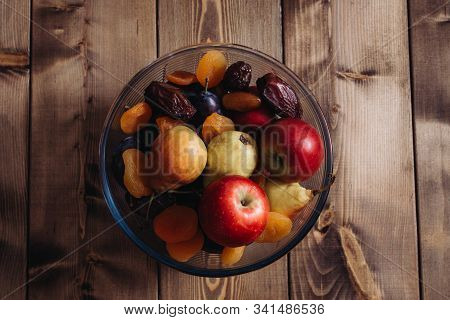 Dried Apricots And Dates Glass Plate, Plum, Apple, Pear In A Plate, Closeup Shot