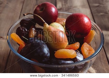 Dried Apricots And Dates Plate, Plum, Apple, Pear In A Plate, Closeup Shot