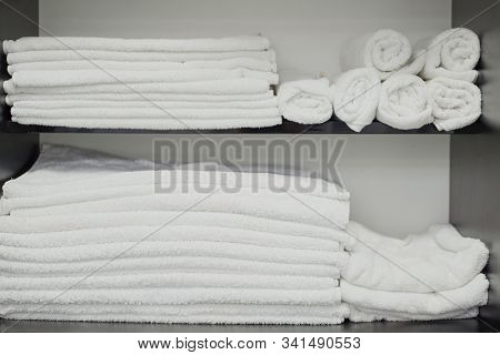 White Towels On A Shelf In A Barber Shop