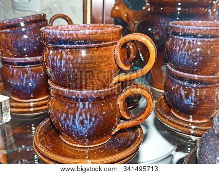 Coffee Cups With Saucer. Latgale Ceramics Is A Traditional Folk Craft. It Was Filled With Glaze Of T