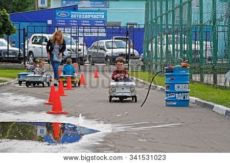 Pushkino, Moscow Region, Russia - July 13, 2019: Children Driving Soviet Pedal Cars 