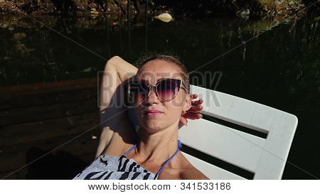 Woman Shooting Self Portrait. Take Photo And Video On Smartphone. Girl Rest, Relax, Walk In Sunglass