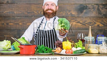 Organic Food. Fresh Ingredients Only. Vegetarian Meal. Man Cooking Fresh Vegetables. Culinary Recipe