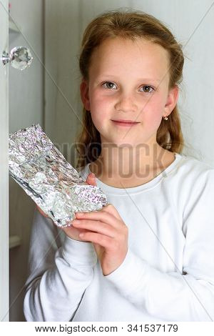 Girl With Afikoman Is A Half-piece Of Matzah Which Is Broken Of The Passover Seder. In Many Families