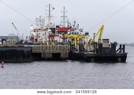 New Bedford, Massachusetts, Usa - December 10, 2019: Lineup Of Offshore Survey Vessels Along Marine 