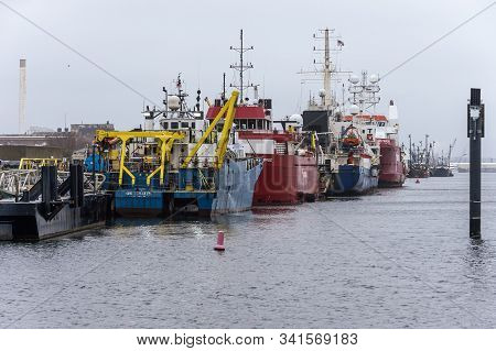 New Bedford, Massachusetts, Usa - December 10, 2019: Lineup Of Offshore Survey Vessels Along Marine 