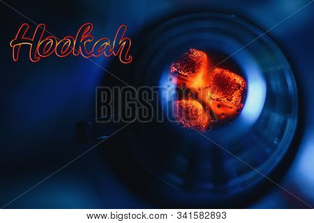 Hot Red Coals For Hookah In A Bowl On A Blue Background