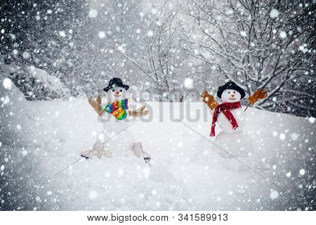 Happy Winter Time. Christmas Party People. Two Happy Smiling Snowman On Sunny Winter Day. Sensual Sn