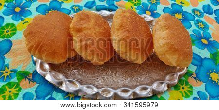 Indian Gujarati Food Puri Or Poori. Homemade Indian Potato Poori Or Puri . Khasta Kachori,bedmi Poor