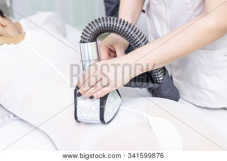 Lpg Girl Body Massage In Spa. The Girl Is Given A Hardware Massage, She Is Wearing A Special Jumpsui