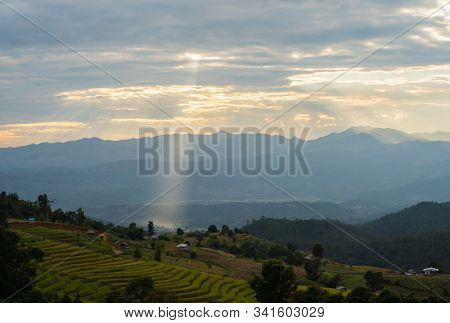 Sunlight Ray Shining On Beautiful Rice Terraces During Sunset In Pa Bong Piang Village In Chiangmai,