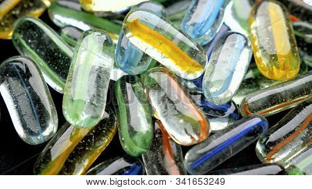 Lots Of Transparent Dragas With Colored Stripes On The Sides
