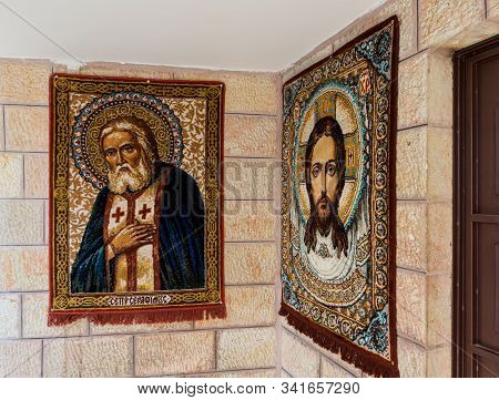 Jerusalem, Israel, December 28, 2018 : Carpets In The Faces Of Jesus And St. Seraphim Hang On The Wa