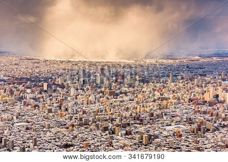 Sapporo, Japan aerial cityscape in winter at twilight.