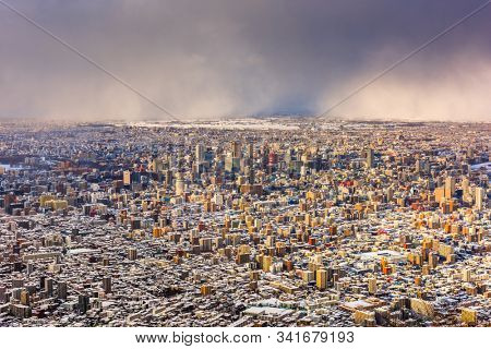 Sapporo, Japan aerial cityscape in winter at twilight.