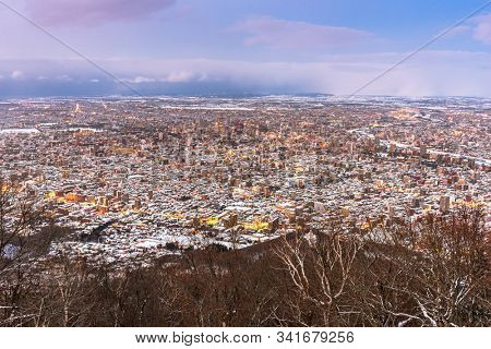 Sapporo, Japan aerial cityscape in winter at twilight.
