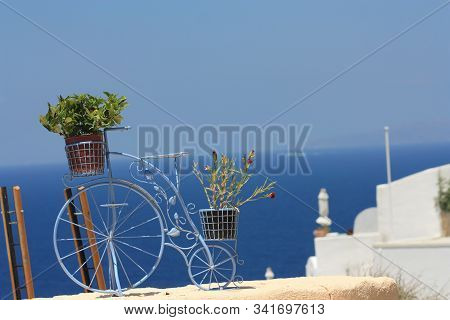 Light Blue Flower Stand Bike On The Background Of Blue Sea