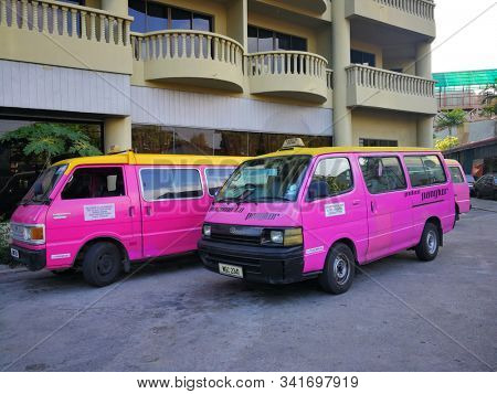 Pangkor Island, Malaysia - 25 December, 2019 :  The Pink Van is the major public transportation in Pangkor Island, Malaysia. 