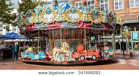 A Vintage Merry-go-round Game In A Paved Square. Eindhoven, Netherlands.