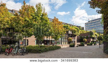 An Empty Paved Plaza Of The City Hosts Parked Bikes. Eindhoven, Netherlands.