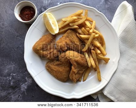 Breaded Crispy Chicken With French Fries And Sauce.