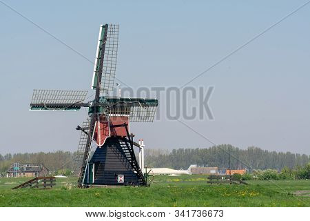 View On Traditional Dutch Wind Mill, Spring Landscape In North Holland