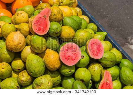 Pile of jocote fruits or mombin hog plum and sineguela sold at a local fresh market in San Jose Costa Rica