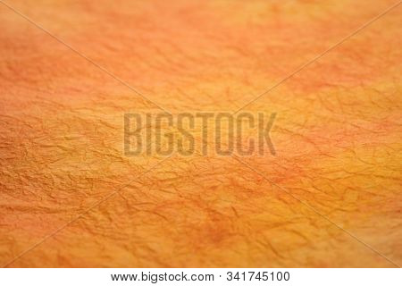 background of orange and red marbled momi paper with a selective focus