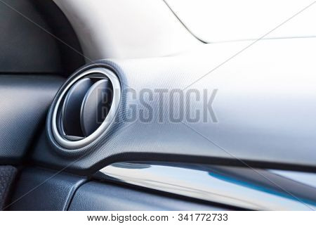 A Close-up View Of A Part Of The Interior Of A Modern Luxury Car With A View Of The Ventilation Defl
