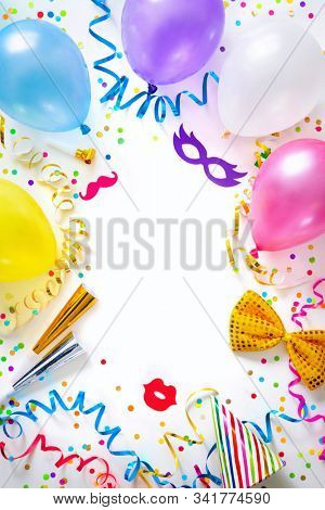 Background for carnival, birthday, New Year or other festivities with air balloons, streamers, confetti and party accessoires
