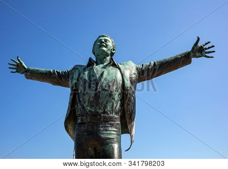 Polignano A Mare, Italy - Sept 17, 2019: Statue Of The Italian Singer And Songwriter Domenico Modugn