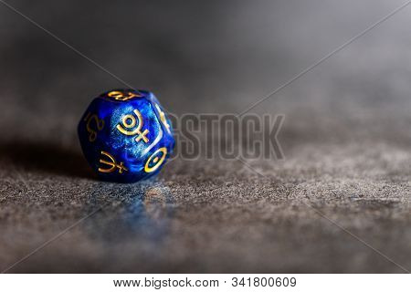 Blue Astrology Dice With Symbol Of The Planet Pluto On Grey Background