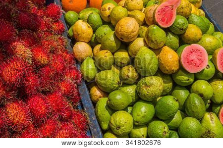 Pile of jocote fruits or mombin hog plum and sineguela sold at a local fresh market in San Jose Costa Rica