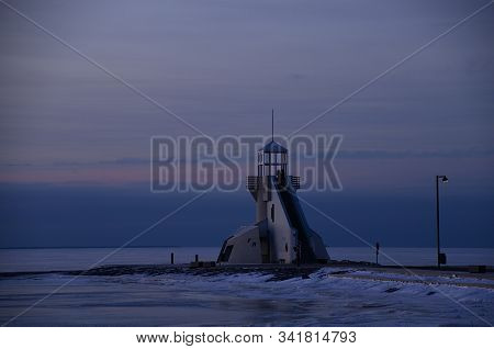 Couple In The Viewing Tower By The Seafront In Winter, Nallikari Beach, Oulu.