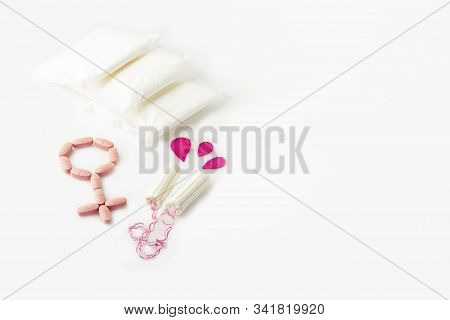 Protective Menstrual Pads, Cotton Tampons And  Gender Symbol Made From Pink Pain Pills Isolated On W