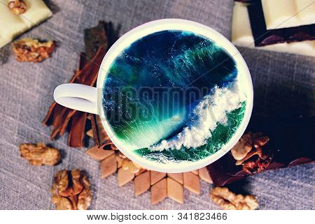White Cup With Water. Sea. Ocean. Sea Waves. Creative Postcard.