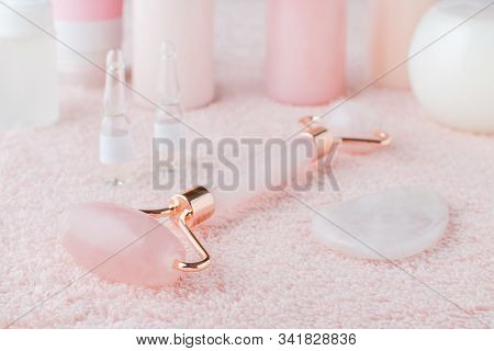 Beautiful Composition Of Spa And Wellness Products, Facial Rose Quartz Roller And Face Serum On Past