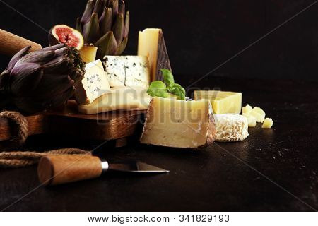 Different Sorts Of Cheese. Cheese Platter With Different Cheese And Spice
