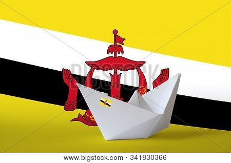 Brunei Darussalam Flag Depicted On Paper Origami Ship Closeup. Handmade Arts Concept