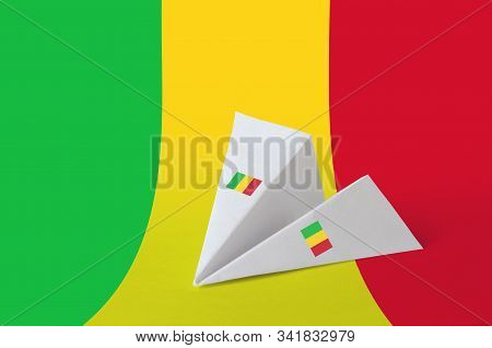 Mali Flag Depicted On Paper Origami Airplane. Handmade Arts Concept