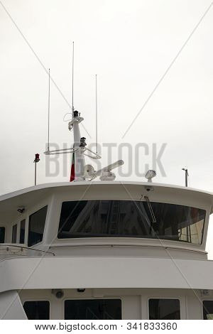 Detail Of White Ferry Cockpit In A Harbour