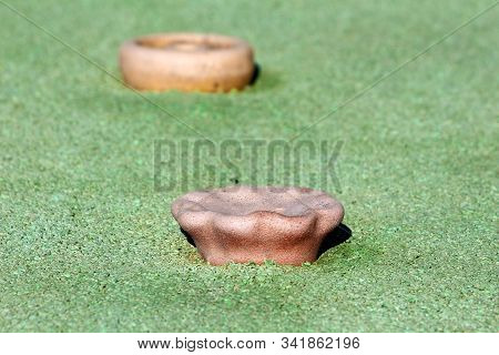 Climbing Wall Holds In Different Shapes And Sizes Surrounded Green Playground Rubber Flooring At Loc